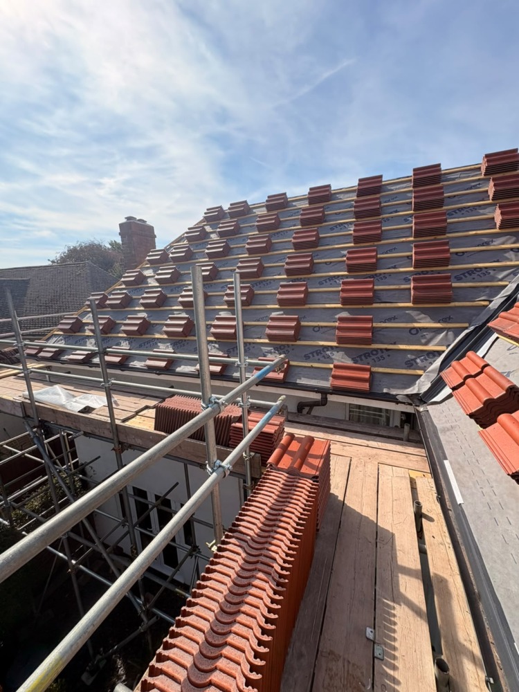 New red tiles stacked on the roof